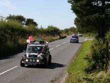 Minis pass Woody Bay Station