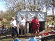 Surrey members with the new Woody Bay water tank