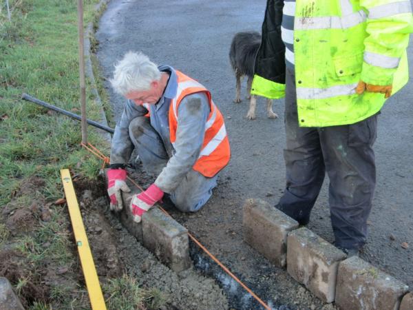 John Heys re-laying the kerb stones. 9th January 2014