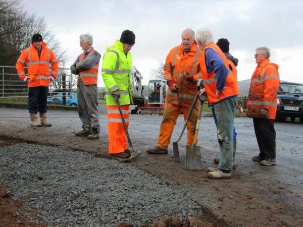 Orange-clad volunteers making light work of the project, 16th January 2014