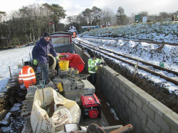 Contractors capping the block wall, 13th February 2014
